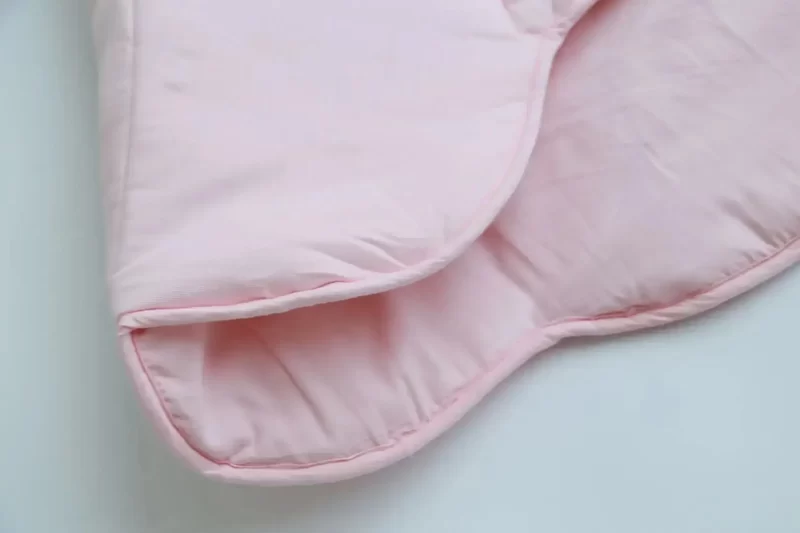 Tapis coquillage pour bébé rose plié